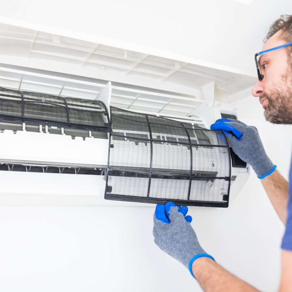 man-changing-filter-of-air-conditioner-indoors-2026-04-13-02-18-47-utc